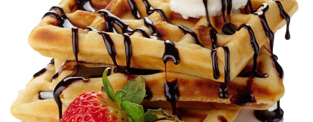 Belgium,Waffles,With,Chocolate,Sauce,,Ice,Cream,And,Strawberries,Isolated