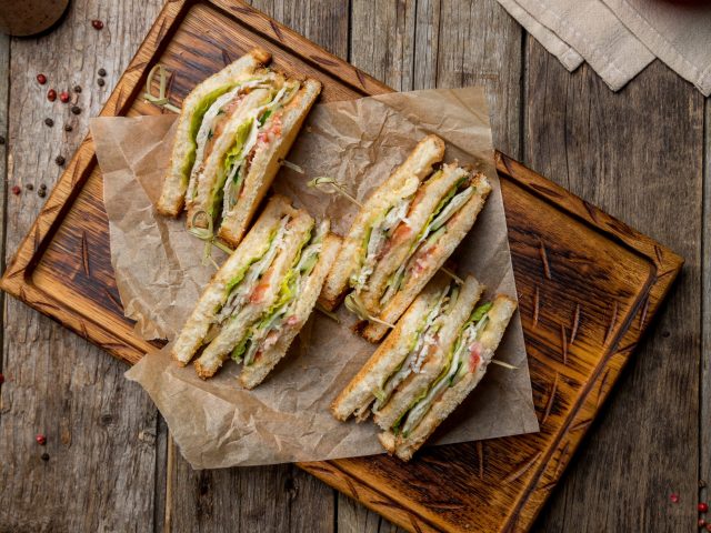 Club,Sandwich,With,Chicken,On,Wooden,Board